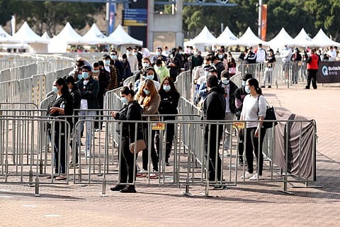 People wait in line to receive the vaccine outside the Qudos Bank Arena NSW Health Vaccination Centre in the Sydney Olympic Park suburb on August 19, 2021.