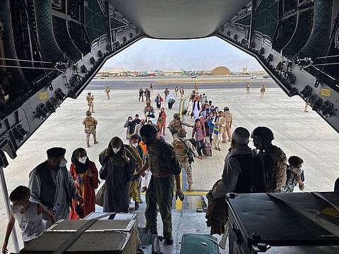 People board a Spanish airforce A400 plane as part of an evacuation plan at Kabul airport in Afghanistan on August 18, 2021.