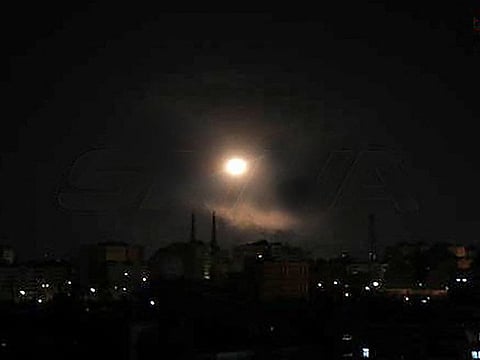 A handout picture released by the official Syrian Arab News Agency (SANA) on August 20, 2021 shows a light spot over the capital Damascus late on August 19, 2021.