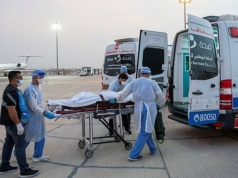 Victims of the blast in Akkar, Lebanon are taken from the plane and loaded into ambulances at Abu Dhabi International Airport.