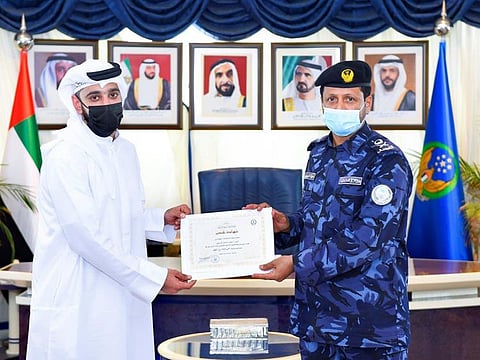 Sharjah Police chief honours man who rescued boy trapped inside a car.