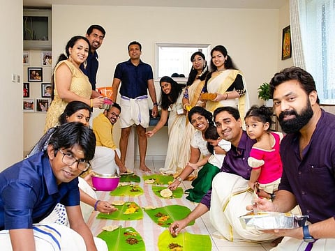 Indian expatriates enjoy the traditional 'Onasadhya' meal in Dubai.