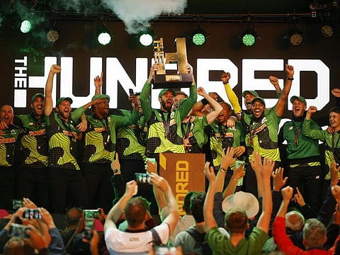 Southern Brave players celebrate with the trophy after winning The Hundred Final.