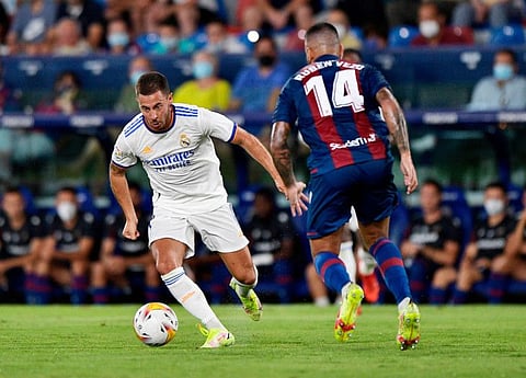Real Madrid's Eden Hazard in action with Levante's Ruben Vezo.