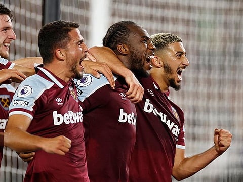 West Ham United's Michail Antonio celebrates scoring their fourth goal with teammates.