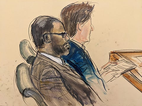 In this courtroom artist's sketch made from a video screen monitor of a Brooklyn courtroom, defendant R. Kelly, left, listens during the opening day of his trial, Wednesday, Aug. 18, 2021 in New York.