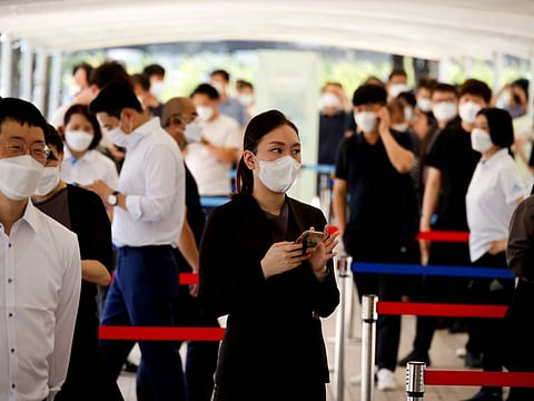People wait in line to get tested for coronavirus in Seoul, South Korea in a file photo.