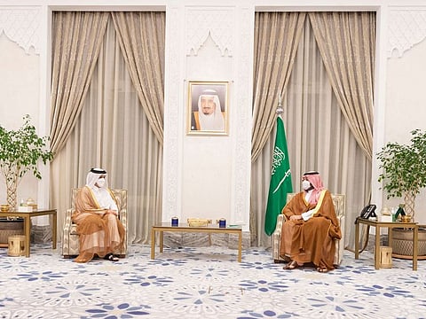 A handout picture provided by the Saudi Royal Palace shows Saudi Crown Prince Mohammed bin Salman (R) during a meeting with Qatar's Foreign Minister Sheikh Mohammed bin Abdulrahman Al Thani on August 25, 2021 in Riyadh.
