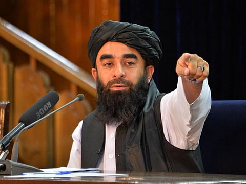 Taliban spokesperson Zabihullah Mujahid gestures during a press conference in Kabul on August 24, 2021 after the Taliban's stunning takeover of Afghanistan.