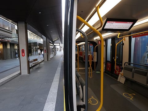 A tram and its platform are empty in Sydney, as greater Sydney continues a weeks-long COVID-19 lockdown.