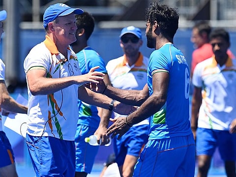 Australian head coach Graham Reid (left) said his aim was to develop a ''next thing mentality'' in the team.