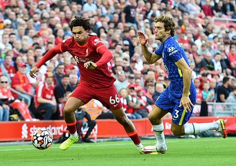 Liverpool's Trent Alexander-Arnold in action with Chelsea's Marcos Alonso at Anfield. The match ended 1-1.