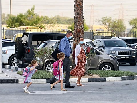 Parents dropping off students at the GEMS Wellington Academy at Al Khail in Dubai this morning