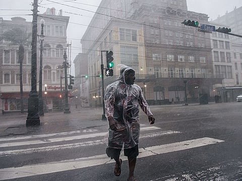 A person crosses the street during Hurricane Ida on August 29, 2021 in New Orleans, Louisiana.