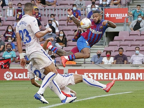 Barcelona's Memphis Depay in action against Getafe during their 2-1 win. Barcelona remain unbeaten on seven points from three games while Getafe have lost all their matches.