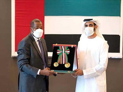Sheikh Shakhbout Bin Nahyan bin Mubarak Al Nahyan, Minister of State, presenting Boukary Sidibe, Ambassador of Mali to the UAE, with the medal at his office in the ministry.