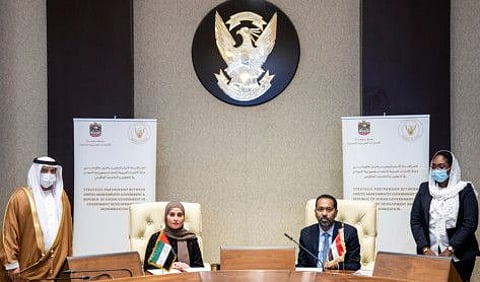 Ohood Al Roumi. UAE's Minister of State for Government Development and the Future, signing the strategic partnership between UAE and sudanese governments.