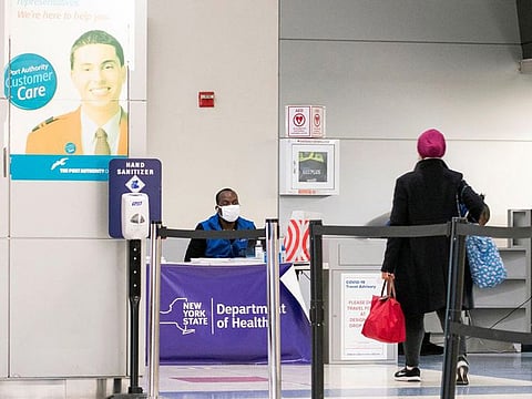 Passengers arrive on a flight from London amid new restrictions to prevent the spread of COVID-19 at JFK International Airport in New York City.