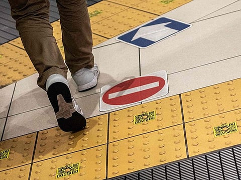The yellow sidewalk pannels, also known as tenji blocks, which are aimed to help people with visual impairments, are seen inside a train station in Tokyo