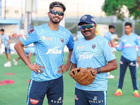 Shreyas Iyer (left) with coach and mentor, Pravin Amre, at a Delhi Capitals practice session at ICC Academy ground in Dubai.
