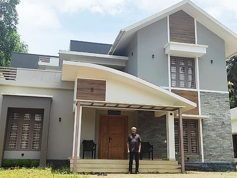 Mamu in front of his house in Kunnamkulam, Kerala, where he spends his retired life.