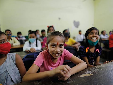 Students attend a class on the first day of partial reopening of schools in Prayagraj, on September 1, 2021.
