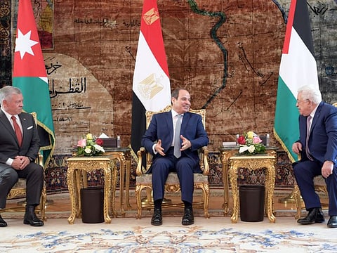 Egyptian President Abdul Fattah Al Sisi (centre) talks with Palestinian President Mahmoud Abbas (right) and Jordan's King Abdullah II before a meeting ahead of the UN general assembly at the Ittihadiya presidential palace in Cairo, Egypt, September 2, 2021 in this handout picture courtesy of the Palestinian President Office.