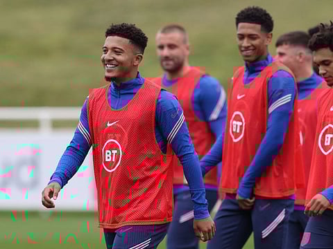 England's midfielder Jadon Sancho (left) is a doubt for England's game against Hungary tonight.