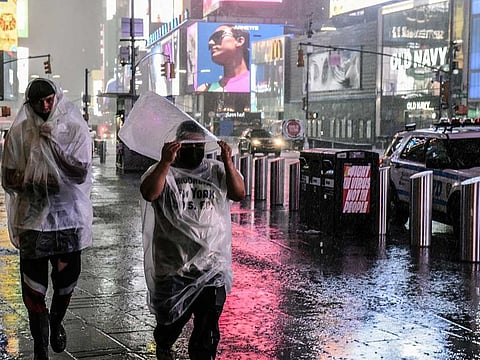Heavy rainfall drenches Times Square in midtown Manhattan late Wednesday night, Sept. 1, 2021.
