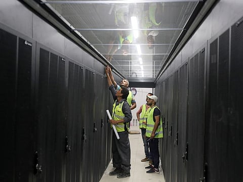 Engineers install server cabinets at an under construction data center in the New Administrative Capital (NAC) east of Cairo, Egypt.