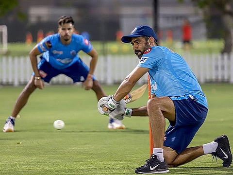 Ajay Ratra, former Indian wicketkeeper and fielding coach of Delhi Capitals, conducts fielding drills as Shreyas Iyer (behind) is on alert at their pre-season camp in Dubai.