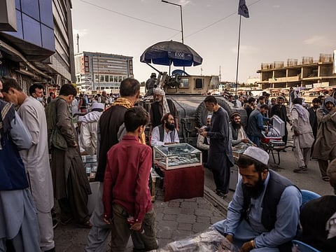 Moneychangers set up outside Kabul’s main currency exchange, which remained closed, in Kabul.