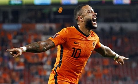 Memphis Depay of the Netherlands celebrates scoring his second goal during the World Cup qualifier against Montenegro in Eindhoven.