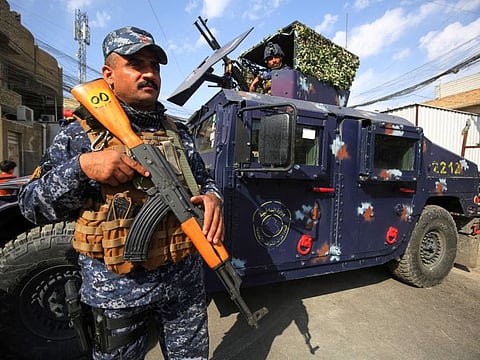 Members of the Iraqi federal police forces stand guard at a checkpoint in a street in the capital Baghdad, during tightened security measures, a day after a man identified as the top Daesh group figure in the country was killed in a file picture. Thirteen policemen were killed in an attack by Daesh against a checkpoint near Kirkuk in northern Iraq, medical and security sources said.