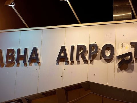 A damaged sign is seen at Abha International Airport after a drone attack by Al Houthi militants in Saudi Arabia on August 31, 2021.