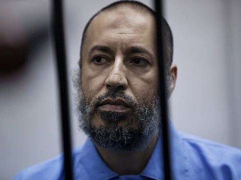 Saadi Gaddafi, son of Muammar Gaddafi, sits behind bars during a hearing at a courtroom in Tripoli, Libya February 7, 2016.