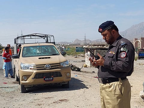 A police officer and rescue workers survey the site after a suicide blast on paramilitary force checkpoint in Quetta. According to an AFP count, since January 1 around 130 people, the majority members of the security forces, have been killed in violence carried out by armed groups fighting -- mainly in the west bordering Afghanistan.