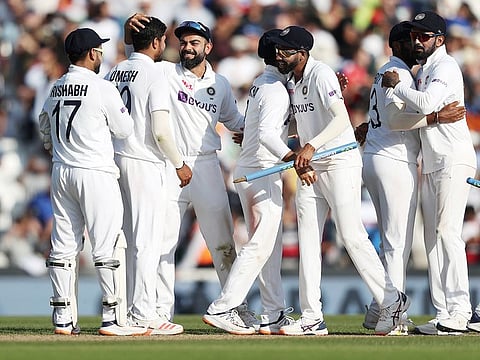India captain Virat Kohli celebrates with teammates after winning Fourth Test match against England at The Oval, in London on Monday.