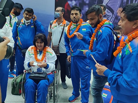 Deepa Malik (in wheelchair), first Indian woman medallist in Paralympics and now President of Paralympics Committee of India (PCI), on her arrival with the last batch of Paralympians from Tokyo on Tuesday.