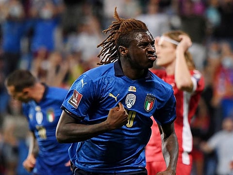 Italy's Moise Kean celebrates scoring their first goal.