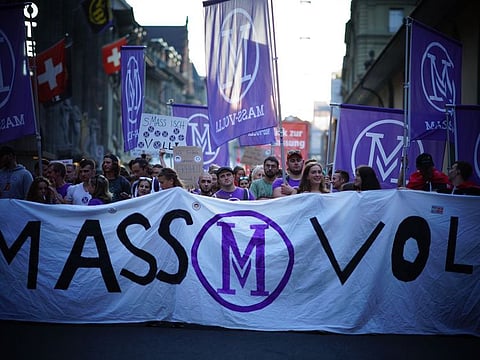 The protesters carried a giant banner saying “Mass Voll” (‘We have had enough’).