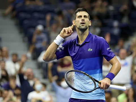 Novak Djokovic of Serbia reacts to the crowd as he plays against Matteo Berrettini of Italy during his Men's Singles quarterfinal match of the US Open at the USTA Billie Jean King National Tennis Center, New York City.