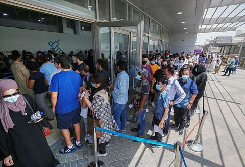 People queue to receive a dose of the COVID-19 vaccine at an inoculation centre in Kuwait City. The improving health situation coincides with 70 per cent of citizens and residents receiving both doses of the COVID-19 vaccine.