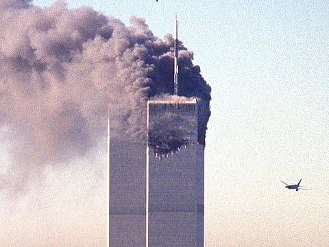A hijacked commercial aircraft approaches the twin towers of the World Trade Center shortly before crashing into the landmark skyscraper in New York.