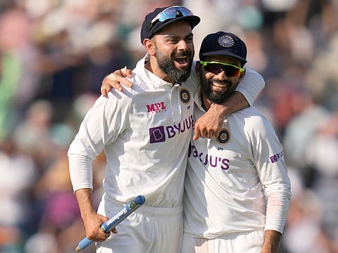 India’s captain Virat Kohli and his deputy Ajinkya Rahane celebrate after India beat England by 157 runs on day five of the fourth Test match at The Oval cricket ground in London on September 6, 2021.