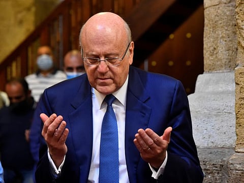 Lebanon's Prime Minister-designate Najib Mikati attends Friday prayers before meeting with Lebanon's President Michel Aoun, at a mosque in Beirut on September 10, 2021.