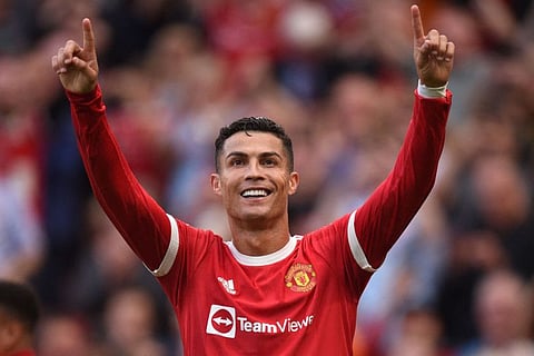 Manchester United's Portuguese striker Cristiano Ronaldo celebrates after scoring their second goal during the English Premier League match against Newcastle at Old Trafford in Manchester, north west England.