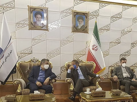 Director General of International Atomic Energy Agency, IAEA, Rafael Mariano Grossi, centre, speaks with Deputy Head of the Atomic Energy Organisation of Iran, Behrouz Kamalvandi, left, upon his arrival at Tehran Imam Khomeini International Airport, Iran, Saturday, September 11, 2021.