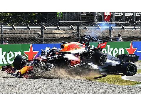 Red Bull's Max Verstappen crashes over Mercedes' Lewis Hamilton during the Italian Grand Prix