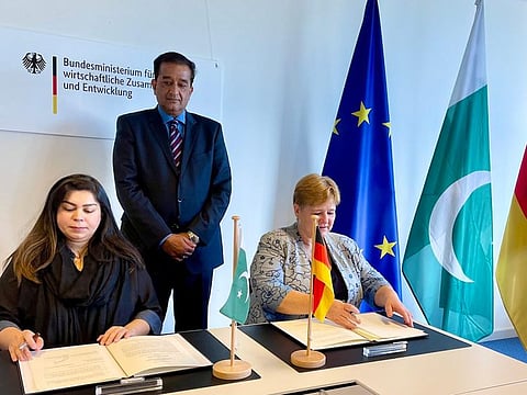 Pakistan PM’s special assistant on climate change Malik Amin Aslam Khan attends the signing ceremony in Islamabad.